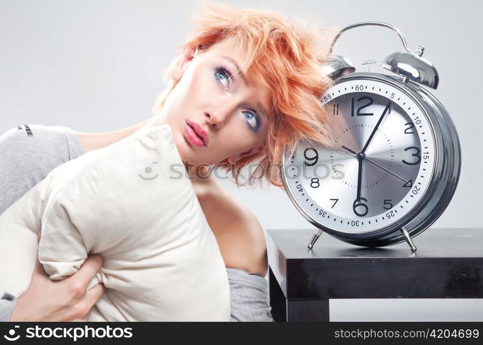 Woman with large alarmclock.