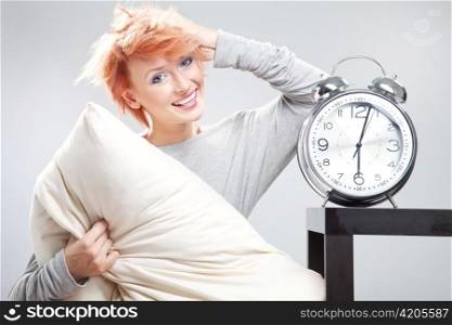 Woman with large alarmclock.