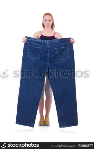 Woman with large jeans in dieting concept