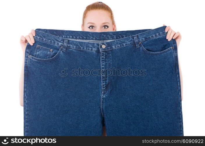 Woman with large jeans in dieting concept