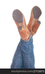 woman with legs up in jeans wearing leather fashion boots (isolated on white background)