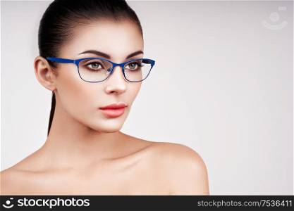 Woman with long eyelashes in eyeglasses. Vision correction. Poor eyesight. Spectacle frame. Makeup, cosmetics, beauty. Close up, macro