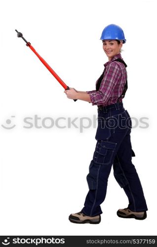 Woman with long handled cutters