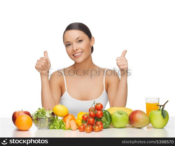 woman with lot of fruits and vegetables showing thumbs up