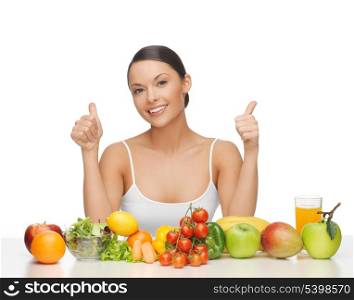 woman with lot of fruits and vegetables showing thumbs up
