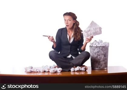 Woman with lots of discarded paper