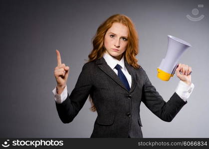 Woman with loudspeaker in studio