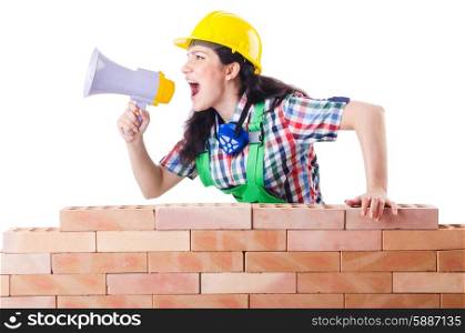Woman with louspeaker near brick wall