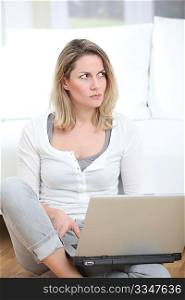 Woman with mad look using laptop computer