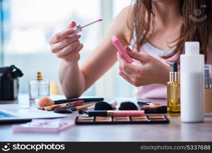 Woman with make-up accessories in beauty concept