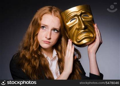 Woman with mask in hypocrisy concept
