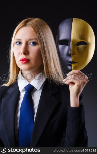 Woman with mask in hypocrisy concept