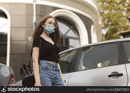 woman with medical mask walking city