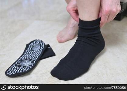 Woman with Medical Tourmaline Self Heating Socks