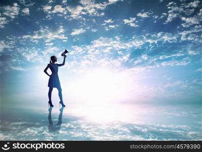 Woman with megaphone. Silhouette of woman at sunset screaming in megaphone