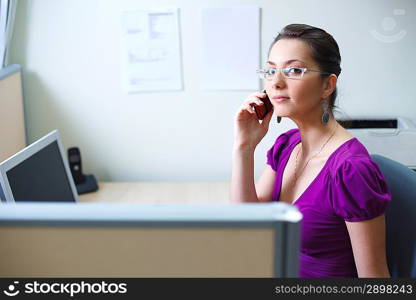 Woman with mobile phone at office in casual clothes