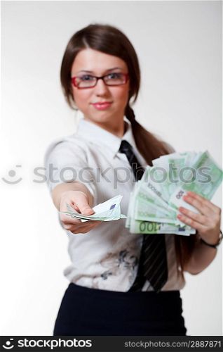 Woman with money. Focused on hand with money.