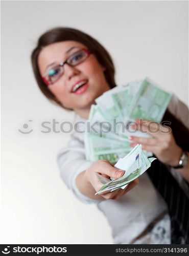 Woman with money. Focused on hand with money.