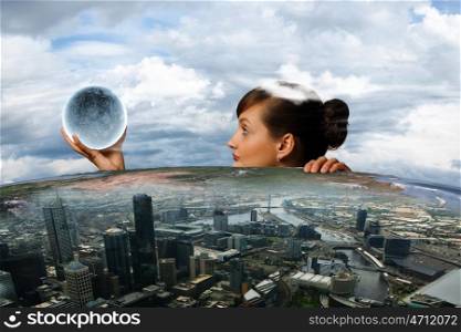 Woman with moon. Young woman holding moon planet in palm