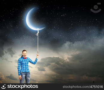 Woman with moon. Young woman in casual holding moon on lace