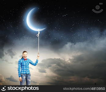 Woman with moon. Young woman in casual holding moon on lace