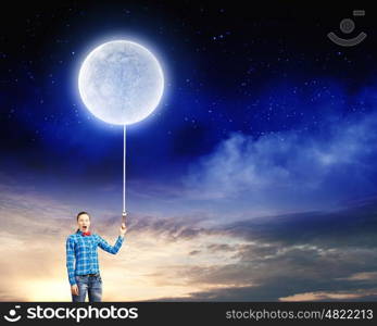 Woman with moon. Young woman in casual holding moon on lace