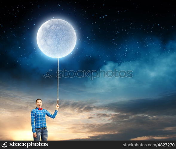 Woman with moon. Young woman in casual holding moon on lace