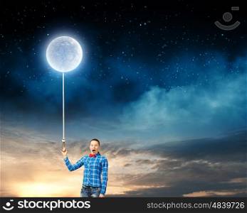 Woman with moon. Young woman in casual holding moon on lace