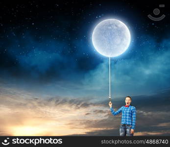 Woman with moon. Young woman in casual holding moon on lace