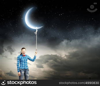 Woman with moon. Young woman in casual holding moon on lace