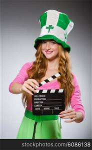 Woman with movie board in saint patrick concept