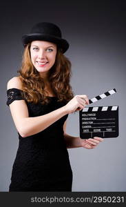 Woman with movie clapper board