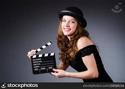 Woman with movie clapper board