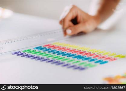 Woman with OCD ? Obsessive compulsive disorder concept. Placing paperclips in a straight line.. OCD or obsessive compulsive disorder concept