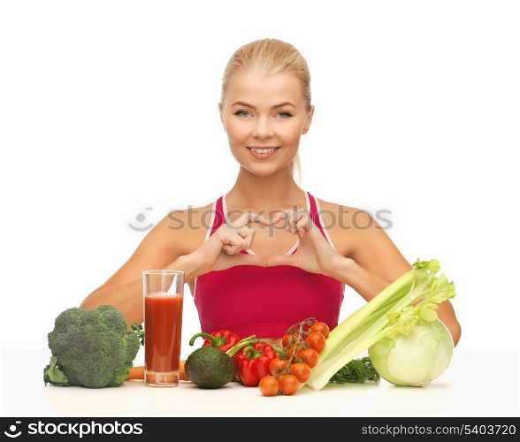 woman with organic food showing heart shape with hands