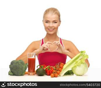 woman with organic food showing heart shape with hands