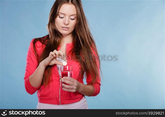 Woman with painkiller pill and water. Health care.. Woman girl holding effervescent painkiller pill tablet and glass of water. Health care. Headache and pain.