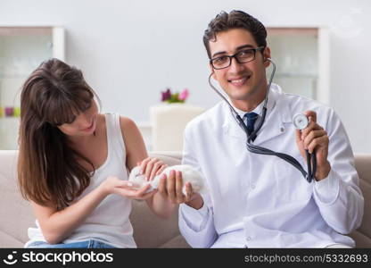 Woman with pet rabbit visiting vet doctor