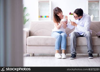 Woman with pet rabbit visiting vet doctor