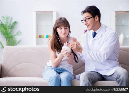 Woman with pet rabbit visiting vet doctor. The woman with pet rabbit visiting vet doctor