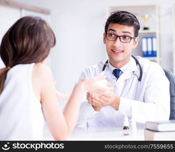 Woman with pet rabbit visiting vet doctor. The woman with pet rabbit visiting vet doctor