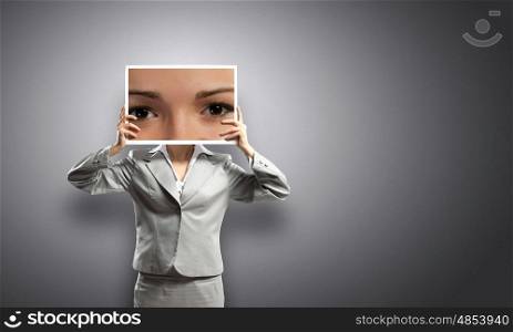 Woman with photo. Businesswoman hiding face behind photo of eyes