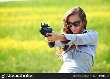 woman with pistol close up portrait
