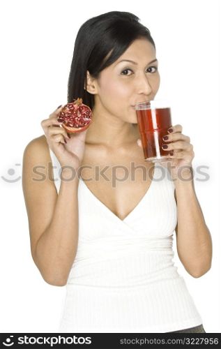 Woman With Pomegranate and Juice
