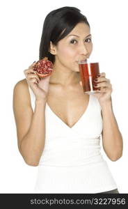 Woman With Pomegranate and Juice