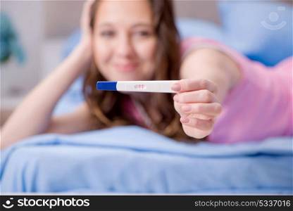 Woman with pregnancy results test