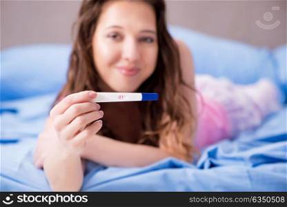 Woman with pregnancy results test