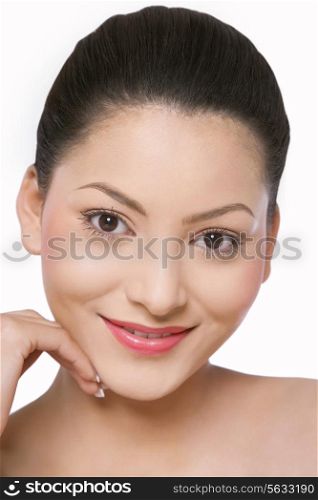 Woman with pretty smile touching her face