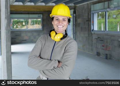 woman with protective ear plugs and helmet