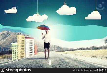 Woman with rainbow umbrella. Young pretty businesswoman with rainbow colorful umbrella